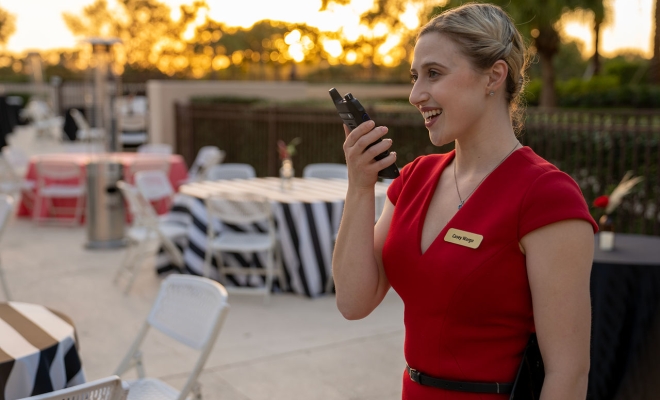 Hospitality worker with two-way radio hotel
